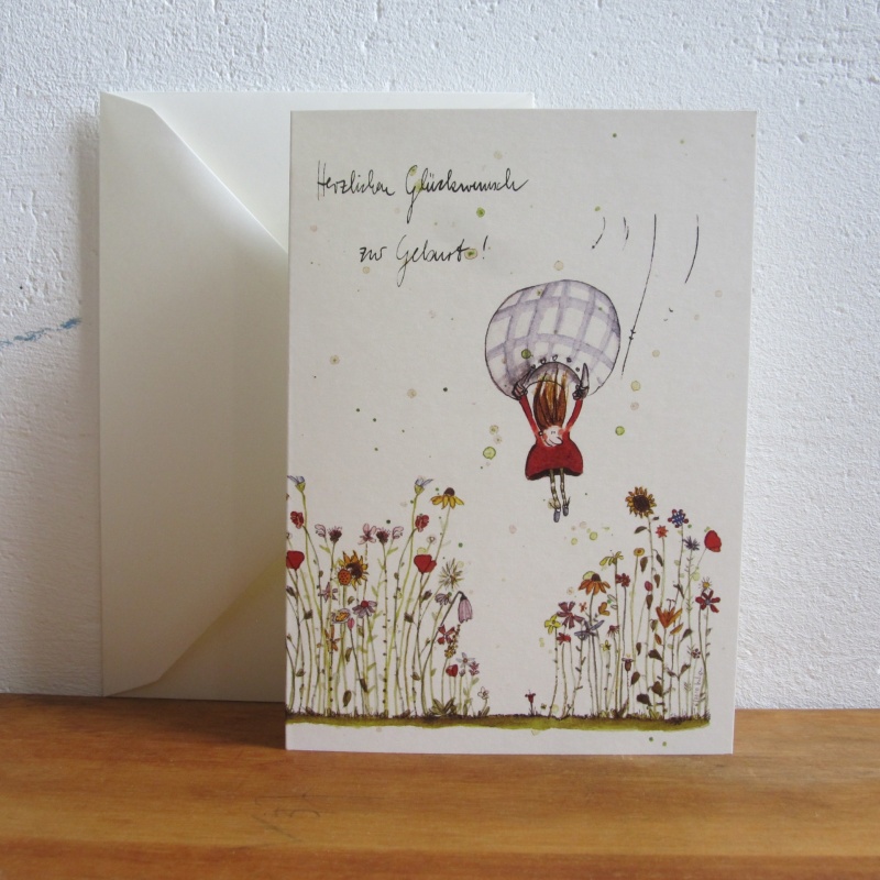 Kind mit Bettbezug landet in Wiese